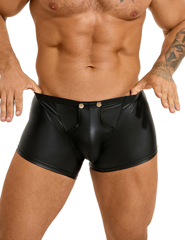 a man with a tattoo on his arm wearing black leather shorts